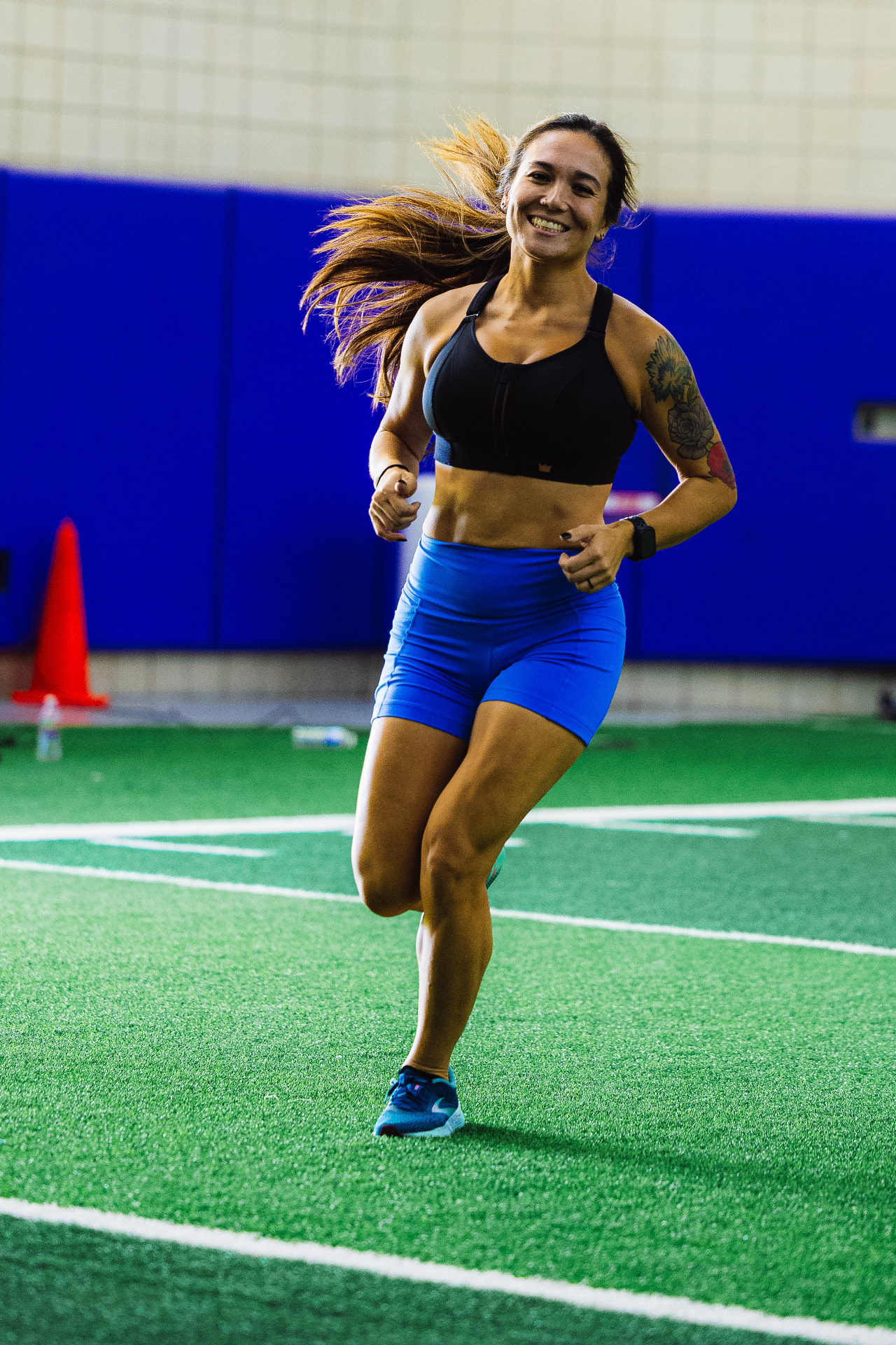 Athlete running on turf at a REV Dash race
